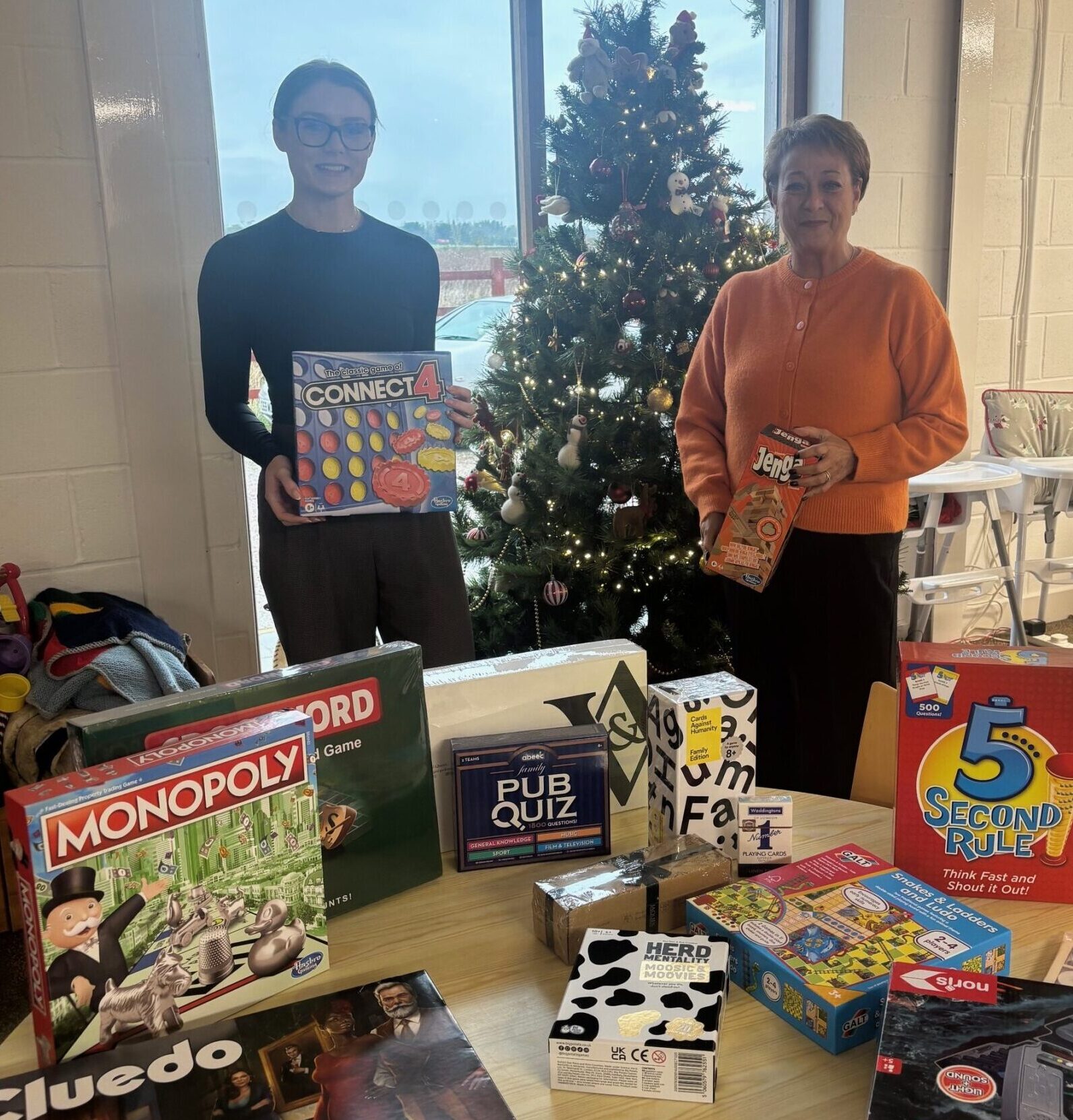 Rosebridge Chester team donating boardgames to Save the Family